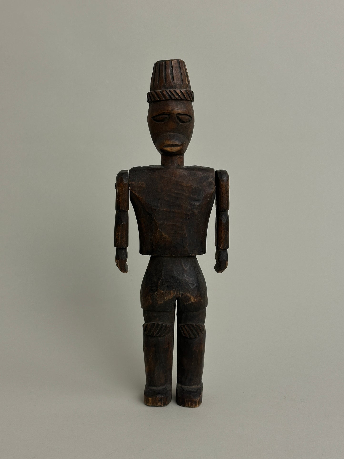 CARVED NORTH AFRICAN FIGURE WITH ARTICULATED ARMS