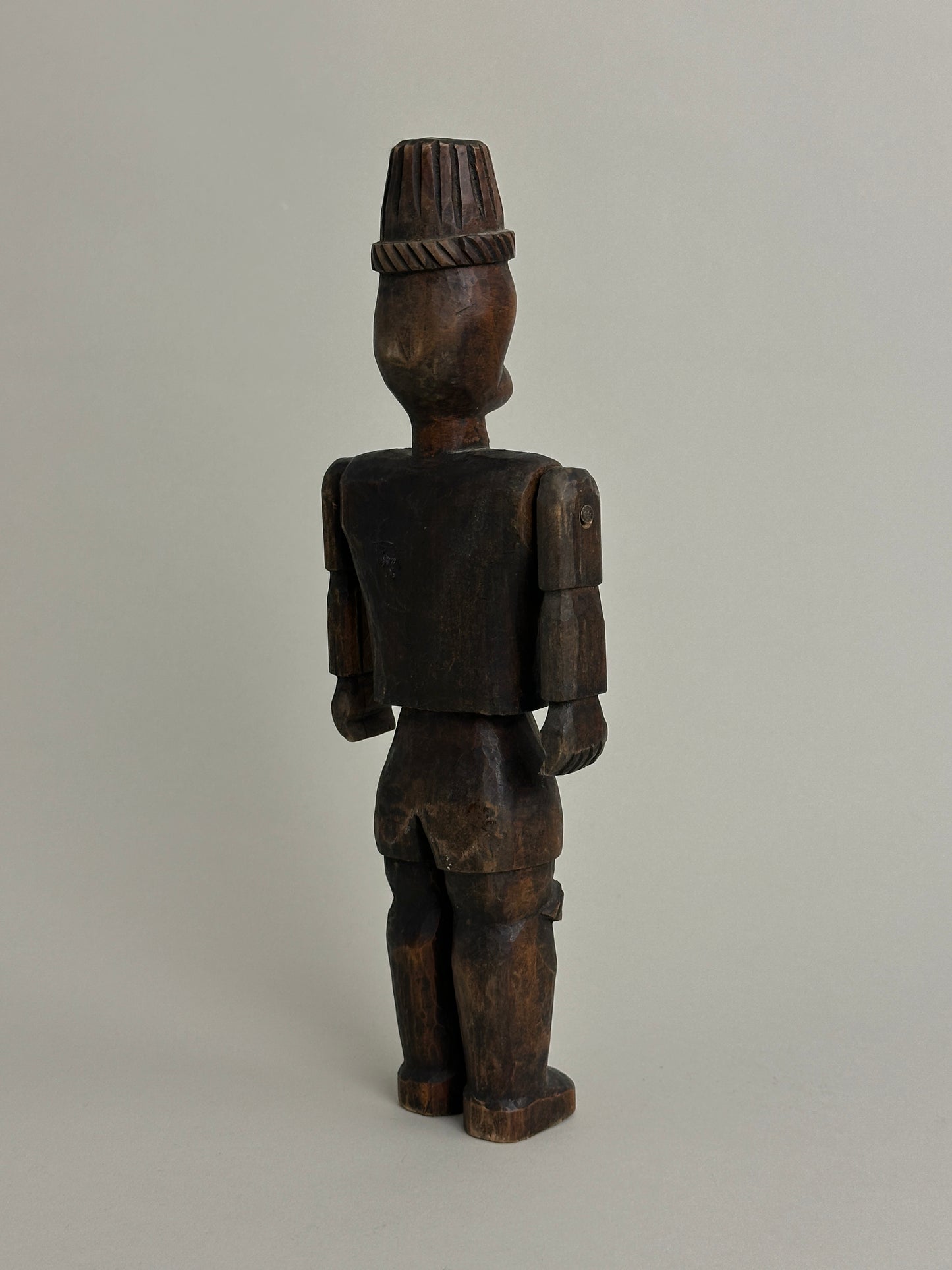 CARVED NORTH AFRICAN FIGURE WITH ARTICULATED ARMS