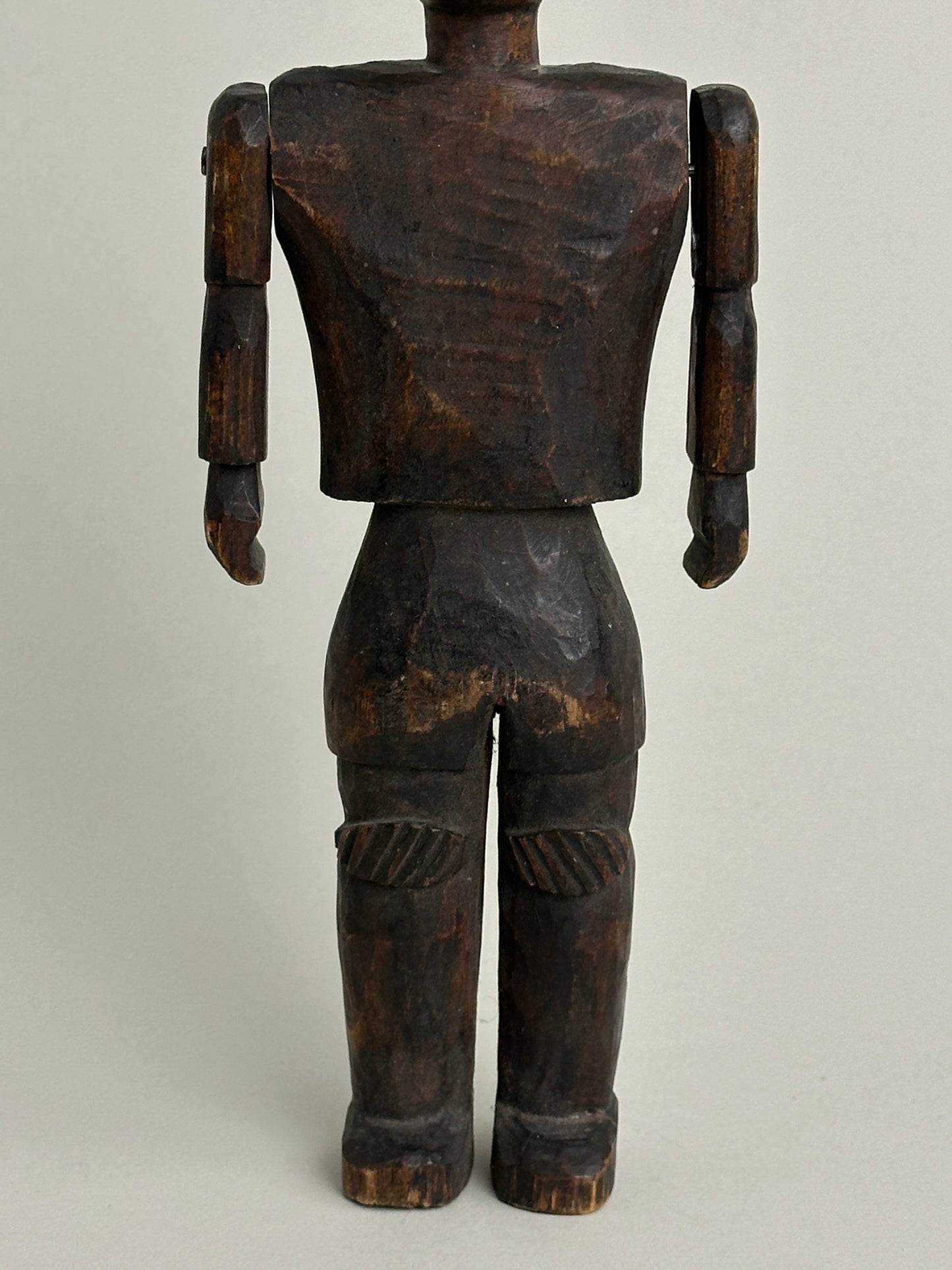 CARVED NORTH AFRICAN FIGURE WITH ARTICULATED ARMS