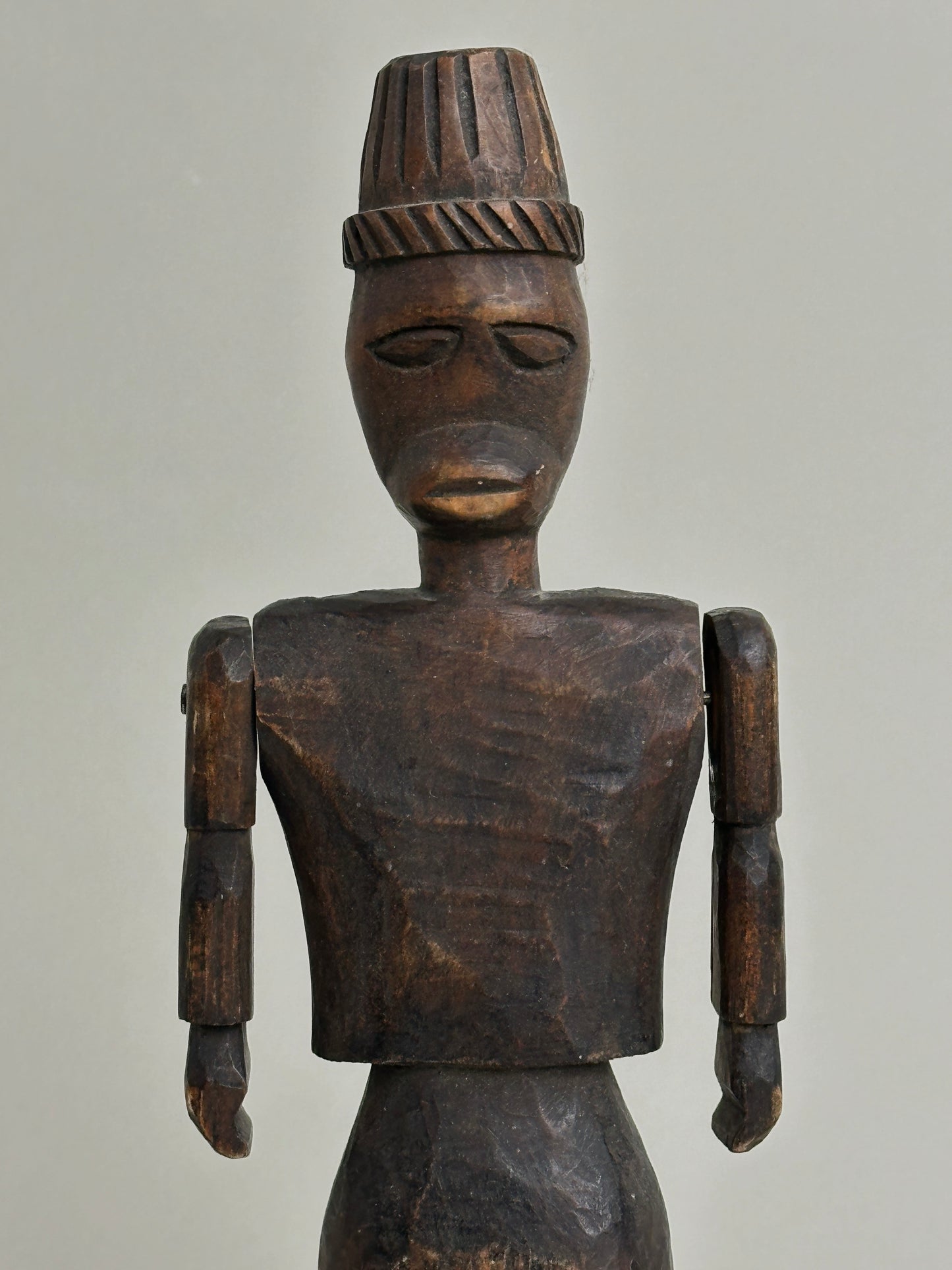 CARVED NORTH AFRICAN FIGURE WITH ARTICULATED ARMS