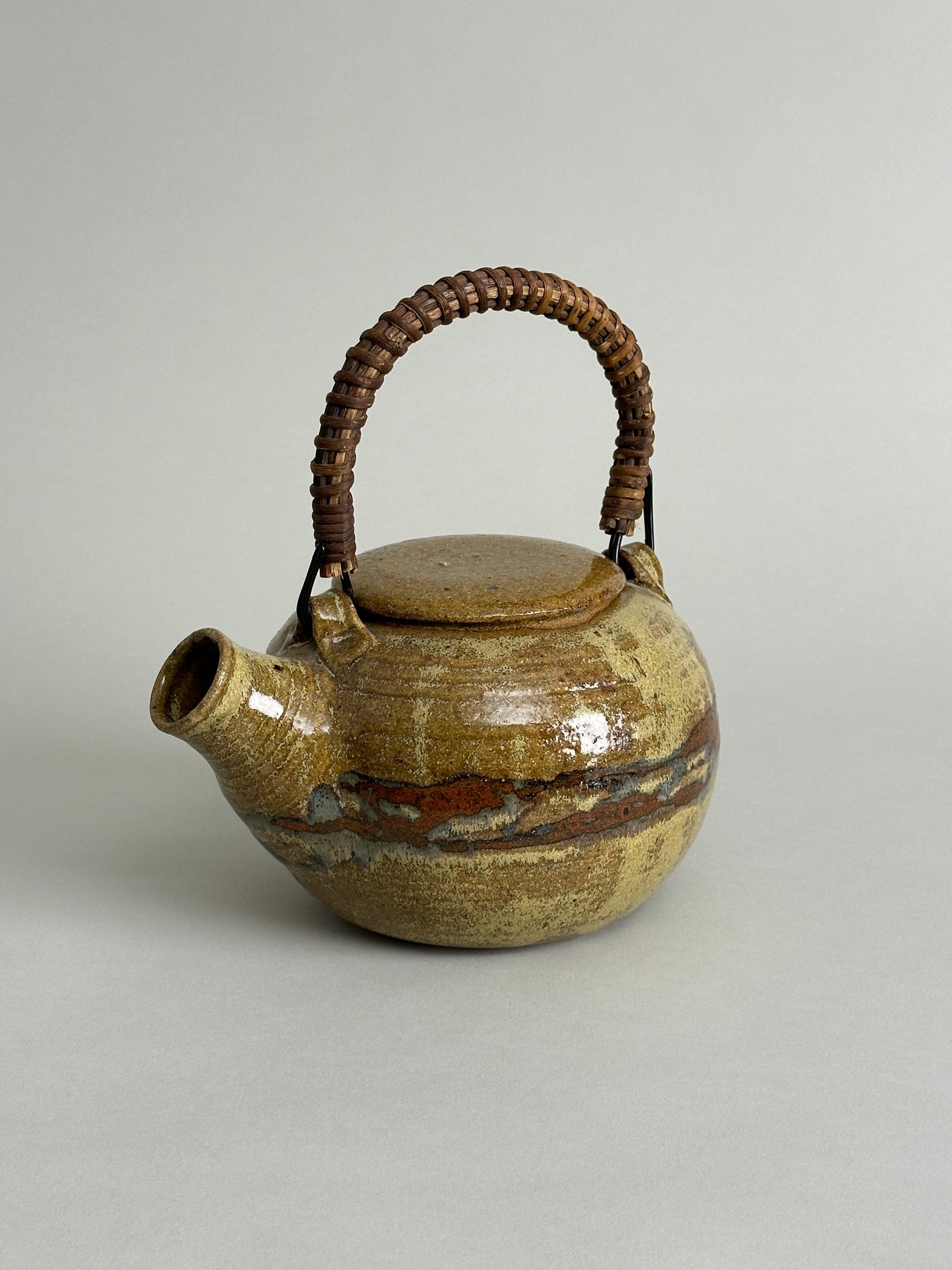 MID CENTURY STUDIO CERAMIC TEAPOT WITH RATTAN HANDLE - SIGNED