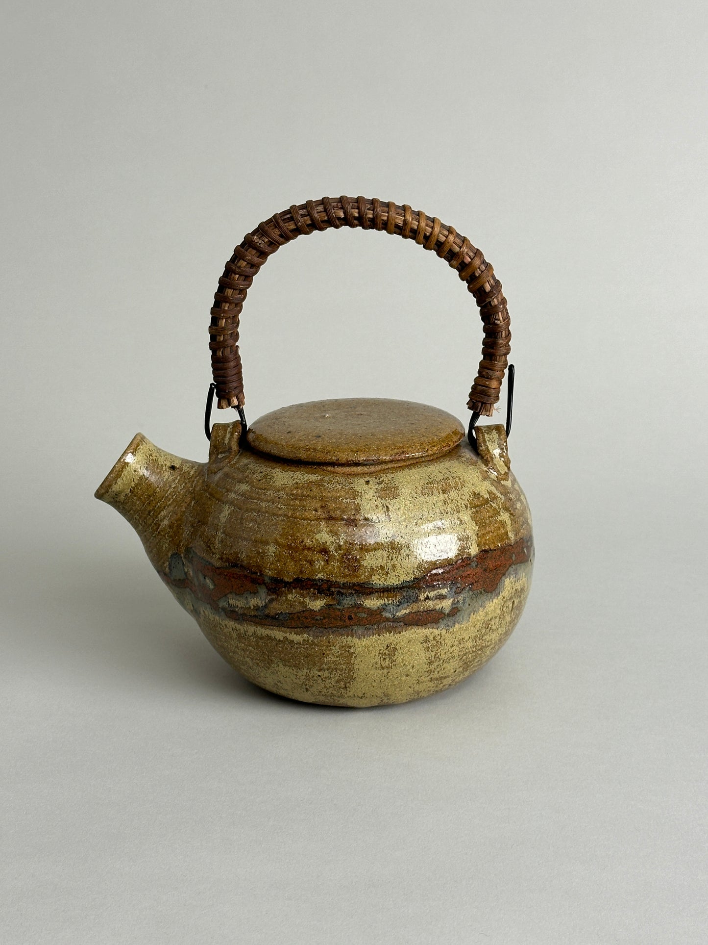 MID CENTURY STUDIO CERAMIC TEAPOT WITH RATTAN HANDLE - SIGNED