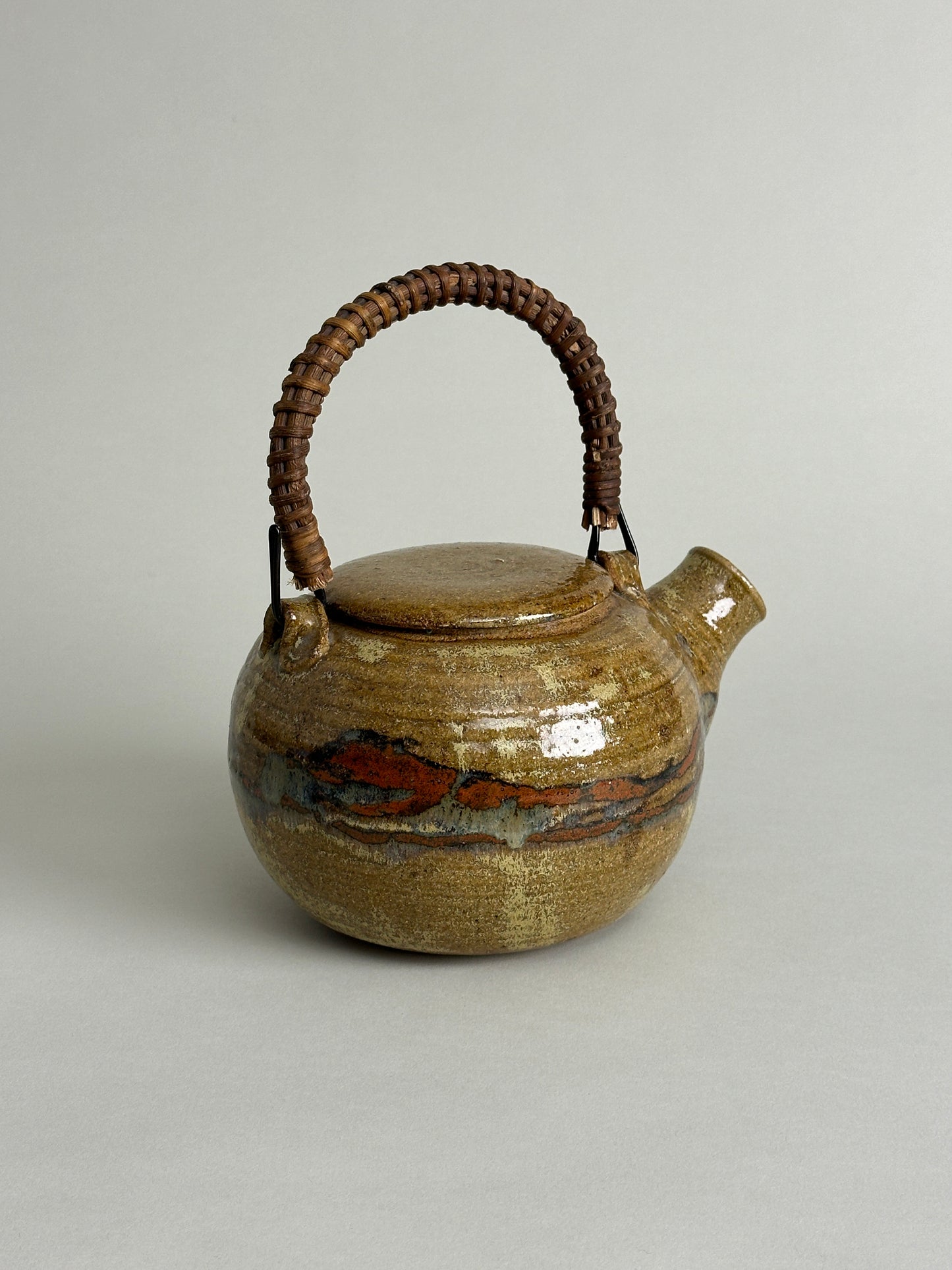 MID CENTURY STUDIO CERAMIC TEAPOT WITH RATTAN HANDLE - SIGNED