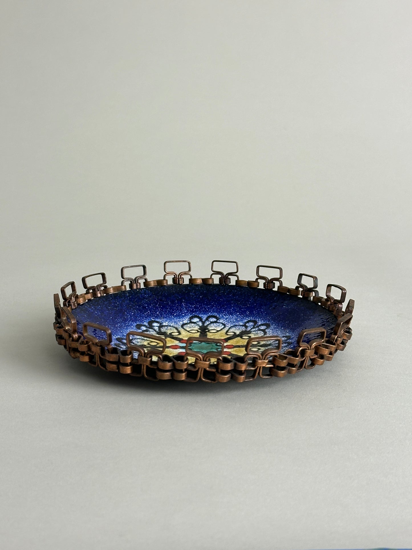 CHILEAN ENAMEL PLATE WITH BRAIDED COPPER EDGING