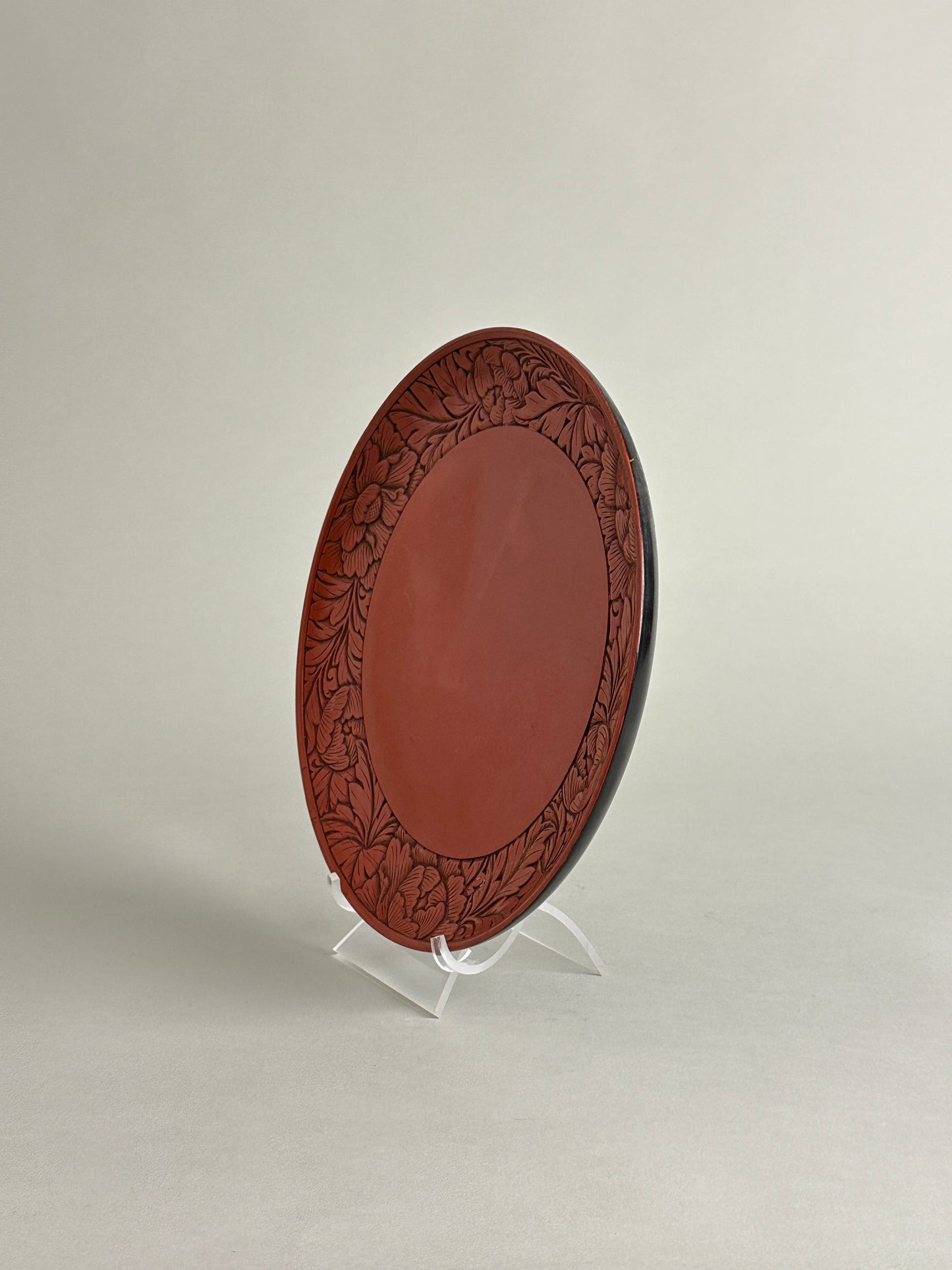 CHINESE LACQUERED WOODEN PLATE WITH CARVED FLORAL BORDER