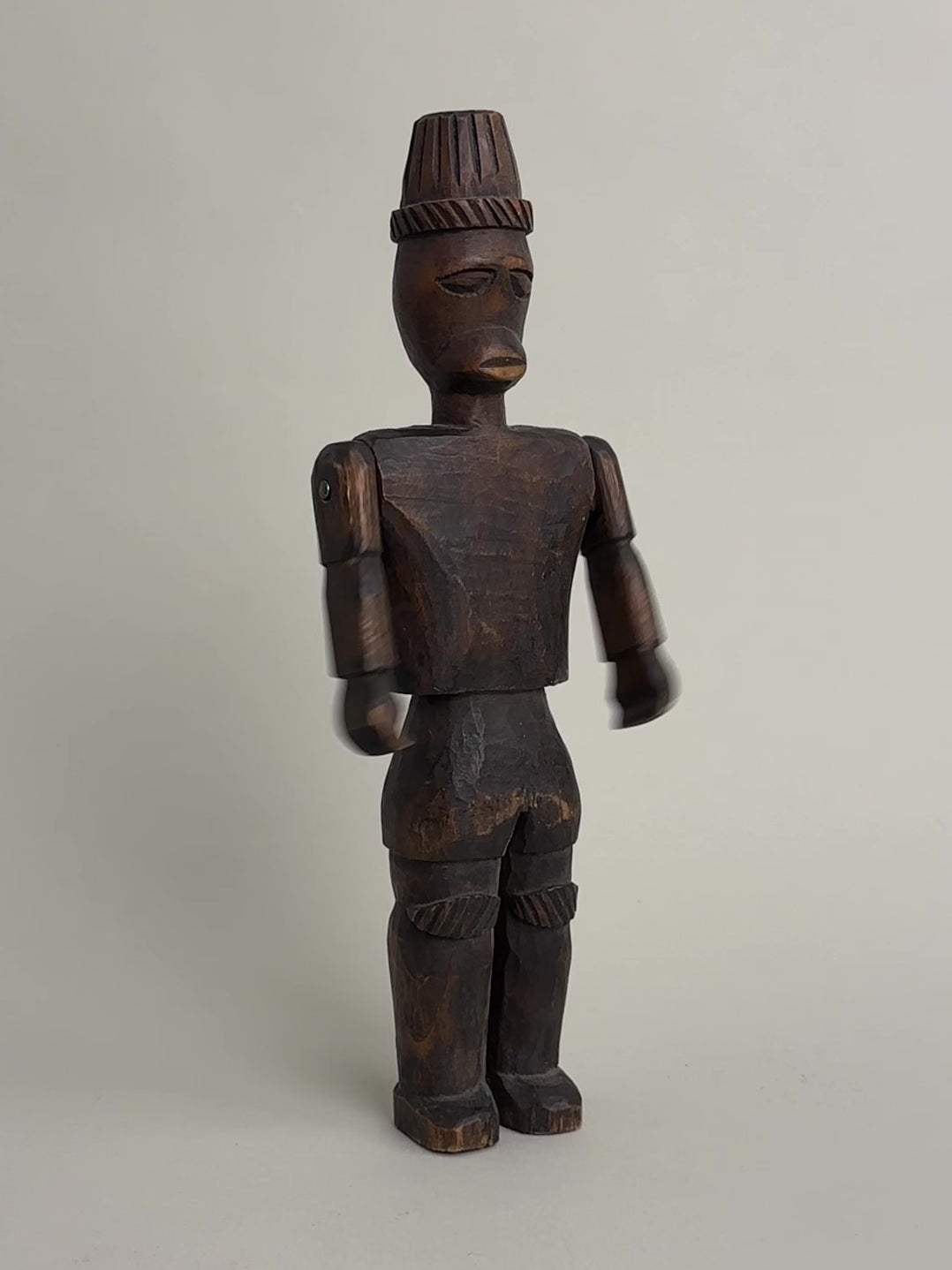 CARVED NORTH AFRICAN FIGURE WITH ARTICULATED ARMS